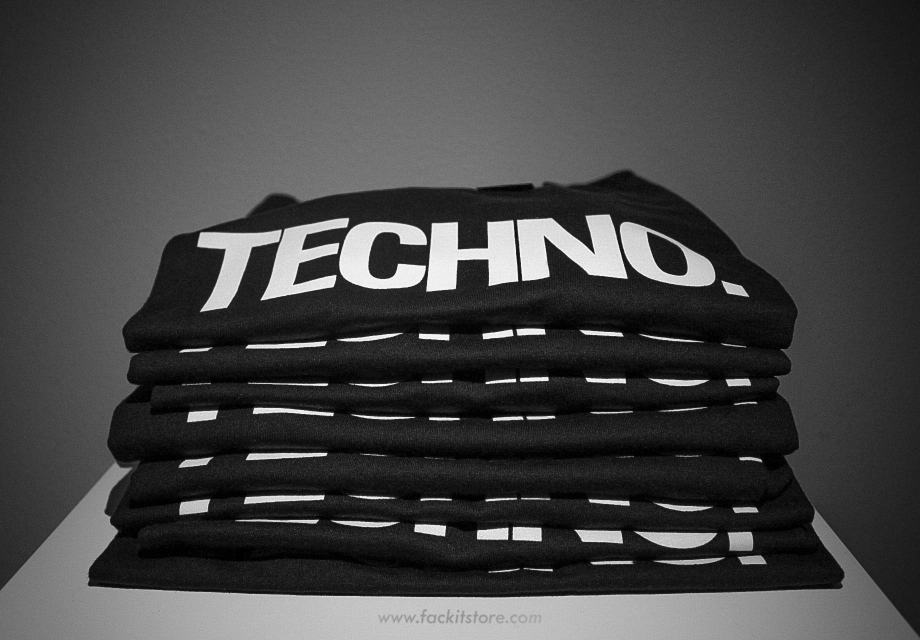 Stack of Black Techno T-Shirts by Official Fack It Store