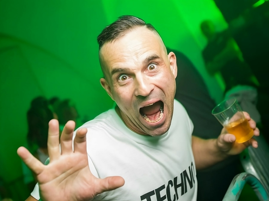 Raver Wearing White Techno T-Shirt at Indoor Techno Festival – Fack It