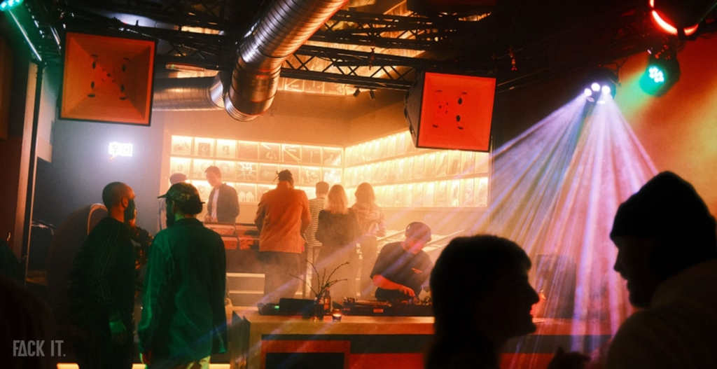 A cozy and vibrant scene at Paak Vinyl Bar in Nijmegen, with vinyl records spinning and people enjoying the atmosphere.